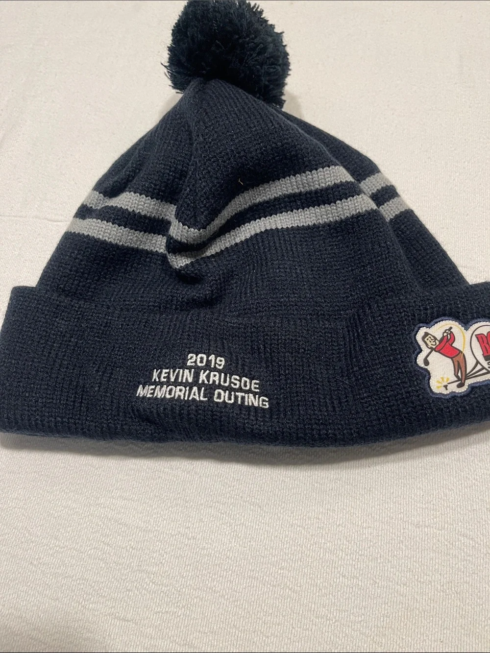 Kevin Krusoe Memorial Outing Pom Beanie Hat - Black with Gray Stripes